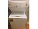 White stacked washer and dryer in home laundry area for efficient space saving at 4830 S Conway Rd # 40, Orlando, FL 32812