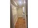 Well-organized laundry room with shelving, tile flooring, and a stackable washer/dryer at 4830 S Conway Rd # 40, Orlando, FL 32812