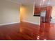 Spacious living room adjacent to the kitchen with glossy hardwood flooring at 4830 S Conway Rd # 40, Orlando, FL 32812