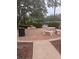 Community picnic area with stone picnic tables and a nearby trashcan at 4830 S Conway Rd # 40, Orlando, FL 32812