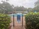 Gated community pool featuring mature landscaping at 4830 S Conway Rd # 40, Orlando, FL 32812