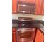 Stainless steel oven is built into the kitchen with dark countertops at 4830 S Conway Rd # 40, Orlando, FL 32812
