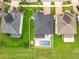 Aerial view showcasing a home with a private pool, adjacent to well-manicured lawns and neighboring houses at 4993 Southlawn Ave, Orlando, FL 32811