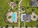 Overhead shot of a community pool, playground, clubhouse, and manicured landscaping at 4993 Southlawn Ave, Orlando, FL 32811