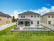 A backyard swimming pool with an outdoor kitchen and patio set, enclosed with a white vinyl fence at 4993 Southlawn Ave, Orlando, FL 32811