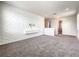 Spacious bonus room with modern accent wall, neutral carpeting, and recessed lighting, great for entertainment at 4993 Southlawn Ave, Orlando, FL 32811