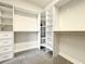 Walk-in closet featuring custom shelves and drawers for organized storage at 4993 Southlawn Ave, Orlando, FL 32811