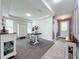 Light-filled dining area with a table and chairs, complemented by ample natural light at 4993 Southlawn Ave, Orlando, FL 32811