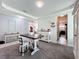Open-concept dining area with contemporary furnishings and easy access to the kitchen at 4993 Southlawn Ave, Orlando, FL 32811