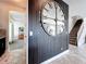 Modern entryway with a decorative wall mirror and staircase at 4993 Southlawn Ave, Orlando, FL 32811