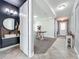 Bright hallway leading to a modern powder room and living spaces at 4993 Southlawn Ave, Orlando, FL 32811