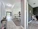 Spacious hallway and dining area, featuring neutral tones and access to the outdoor patio at 4993 Southlawn Ave, Orlando, FL 32811