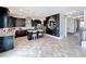 Spacious eat-in kitchen features dark cabinets, a large island, and stainless steel appliances at 4993 Southlawn Ave, Orlando, FL 32811