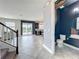 Open-concept living area featuring a half-bath, tile flooring, and sliding doors to the outdoor patio at 4993 Southlawn Ave, Orlando, FL 32811