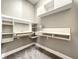 Modern office space with sleek built-in shelves and desk, and neutral wall color at 4993 Southlawn Ave, Orlando, FL 32811