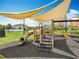 Community playground featuring a slide, shade, and swings for neighborhood families at 4993 Southlawn Ave, Orlando, FL 32811