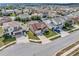 Aerial view of the home in a well-developed neighborhood with manicured lawns at 5018 Tupelo Ct, Minneola, FL 34715