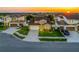 Aerial view features a house with a lawn, driveway and neighboring houses at 5018 Tupelo Ct, Minneola, FL 34715