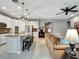 Bright living room with views of the kitchen, comfortable seating and stylish decor at 5018 Tupelo Ct, Minneola, FL 34715