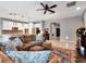 Open-concept living space with kitchen view, stylish furnishings and a cozy atmosphere at 5018 Tupelo Ct, Minneola, FL 34715