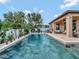Beautiful backyard featuring a private pool, covered patio, and lush landscaping, ideal for outdoor living at 5018 Tupelo Ct, Minneola, FL 34715