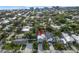 Lovely aerial view of property; charming neighborhood featuring lush green trees and manicured lawns at 507 S Pine St, New Smyrna Beach, FL 32169