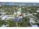 An aerial view of neighborhood showcasing the home's location near the water and local businesses at 507 S Pine St, New Smyrna Beach, FL 32169