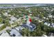 Charming neighborhood near water; lovely home features mature landscaping in this aerial view at 507 S Pine St, New Smyrna Beach, FL 32169