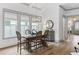 Elegant dining room featuring a modern chandelier and ample natural light at 507 S Pine St, New Smyrna Beach, FL 32169