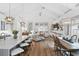 Open-concept living room featuring high ceilings, abundant natural light, hardwood floors, and modern decor at 507 S Pine St, New Smyrna Beach, FL 32169