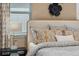 Bedroom with decorative pillows and bedside table with lamp at 5630 Stockade Blvd, St Cloud, FL 34771