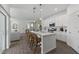 Bright open kitchen featuring a large island with seating and stainless steel appliances at 5630 Stockade Blvd, St Cloud, FL 34771