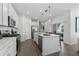 Modern kitchen with stainless steel appliances, sleek countertops, and a view to the outdoor patio at 5630 Stockade Blvd, St Cloud, FL 34771