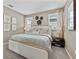 Relaxing main bedroom with modern decor, comfortable bed, and bright windows at 5630 Stockade Blvd, St Cloud, FL 34771
