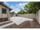 Spacious backyard with a large concrete pad and a detached garage at 622 S Ingraham Ave, Lakeland, FL 33801