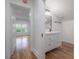 Modern bathroom with vanity and view into the bedroom at 622 S Ingraham Ave, Lakeland, FL 33801