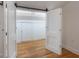 Bedroom view showcases hardwood floors, closet, and fresh white paint at 622 S Ingraham Ave, Lakeland, FL 33801