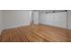 Bedroom featuring hardwood floors, closet, and fresh white paint at 622 S Ingraham Ave, Lakeland, FL 33801