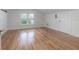 Bright bedroom with hardwood floors, window, and ample space at 622 S Ingraham Ave, Lakeland, FL 33801