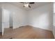 Bright bedroom with hardwood flooring, ceiling fan, and large windows at 622 S Ingraham Ave, Lakeland, FL 33801