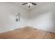 Spacious bedroom with hardwood floors, neutral walls, and ceiling fan at 622 S Ingraham Ave, Lakeland, FL 33801
