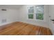 Bright bedroom featuring hardwood floors and double windows providing natural light at 622 S Ingraham Ave, Lakeland, FL 33801