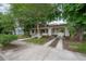 View of the driveway, carport and walkway to the charming home at 622 S Ingraham Ave, Lakeland, FL 33801