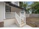 Charming exterior of a home with a well-maintained front porch and tidy landscaping at 622 S Ingraham Ave, Lakeland, FL 33801