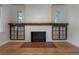 Elegant fireplace with unique tiled surround, classic mantel, and built-in cabinets at 622 S Ingraham Ave, Lakeland, FL 33801