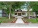 Charming craftsman home featuring a welcoming front porch, landscaped yard, and convenient carport at 622 S Ingraham Ave, Lakeland, FL 33801