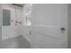 Clean laundry room with window, white walls, and tile floors at 622 S Ingraham Ave, Lakeland, FL 33801