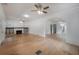 Bright and airy living room with hardwood floors, an archway, and a decorative fireplace at 622 S Ingraham Ave, Lakeland, FL 33801