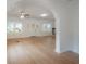 Spacious living room featuring hardwood floors, an archway, and windows with natural light at 622 S Ingraham Ave, Lakeland, FL 33801