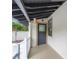 Covered porch with sleek railing and exterior door at 622 S Ingraham Ave, Lakeland, FL 33801